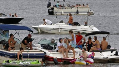 Boaters gather at the confluence of the Allegheny, Monongahela, and Ohio Rivers in downtown Pittsburgh, Pa., on June 26, 2020. Cases of the novel coronavirus hit a new high on Saturday in Allegheny County on Saturday, with 90 new cases reported. Gene J. Puskar/AP