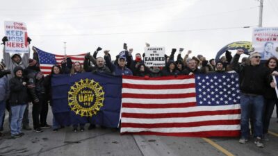 General Motors workers cheer for support outside the plant on March 6, 2019, in Lordstown, Ohio, just before GM ended nearly 50 years of auto production at its sprawling facility near Youngstown. Tony Dejak/AP