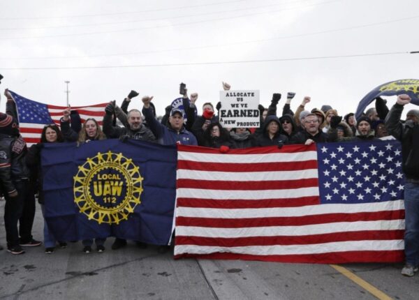 General Motors workers cheer for support outside the plant on March 6, 2019, in Lordstown, Ohio, just before GM ended nearly 50 years of auto production at its sprawling facility near Youngstown. Tony Dejak/AP