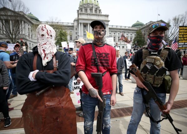 Protesters and militia gathered outside the Capitol in Harrisburg this April for a reopen protest. A recent report by a worldwide nonprofit that tracks militia groups said Pennsylvania is one of five U.S. states at high risk of violence through Nov. 3. (DAVID MAIALETTI / Philadelphia Inquirer)
