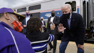 Supporters greet Democratic presidential candidate former Vice President Joe Biden as he steps of the train at Amtrak's Alliance Train Station, Wednesday, Sept. 30, 2020, in Alliance, Ohio. Biden is on a train tour through Ohio and Pennsylvania today. (AP Photo/Andrew Harnik)