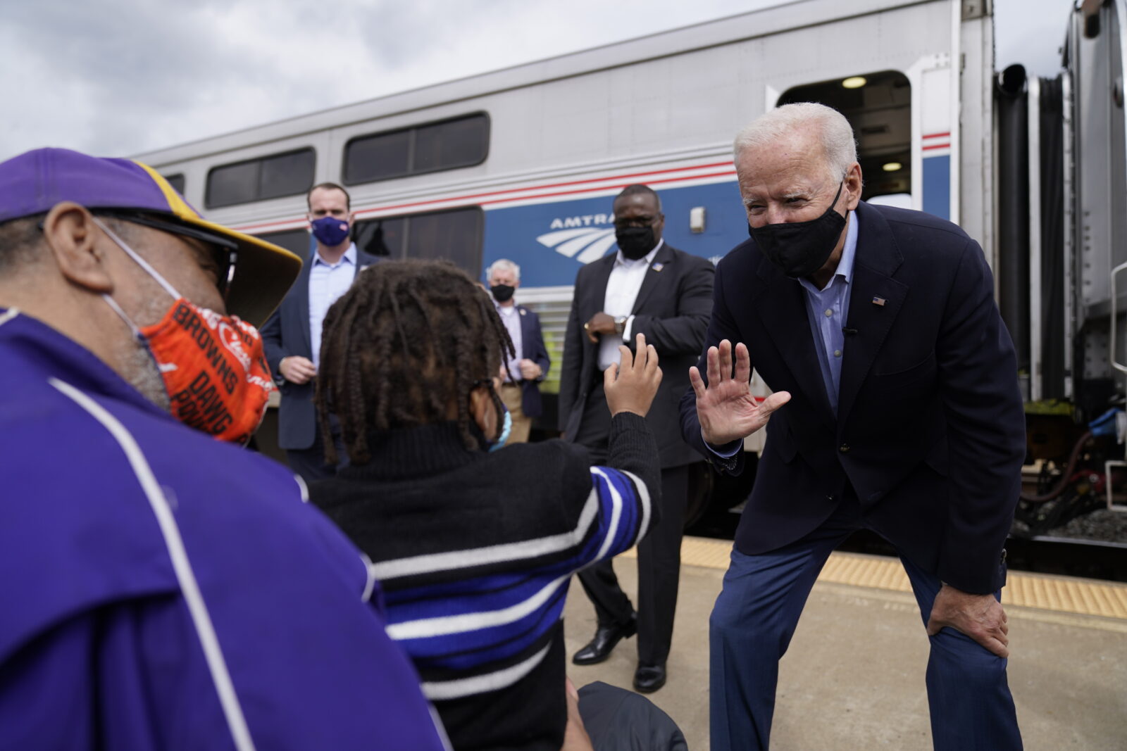 Supporters greet Democratic presidential candidate former Vice President Joe Biden as he steps of the train at Amtrak's Alliance Train Station, Wednesday, Sept. 30, 2020, in Alliance, Ohio. Biden is on a train tour through Ohio and Pennsylvania today. (AP Photo/Andrew Harnik)