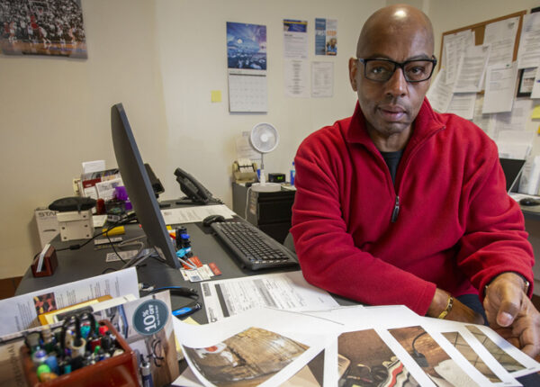 Fred Way is executive director of the Pennsylvania Alliance of Recovery Residences, which voluntarily certifies recovery houses. Here, he shows photographs of residences in the process of being inspected. (ALEJANDRO A. ALVAREZ / Philadelphia Inquirer)