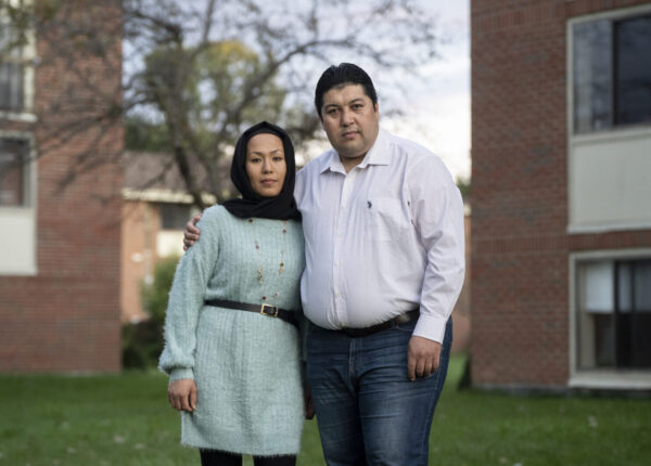 Mustafa and Noorya Aahangaran stand for a portrait in Getzville, N.Y., September 30, 2021. Libby March for Postindustrial Magazine