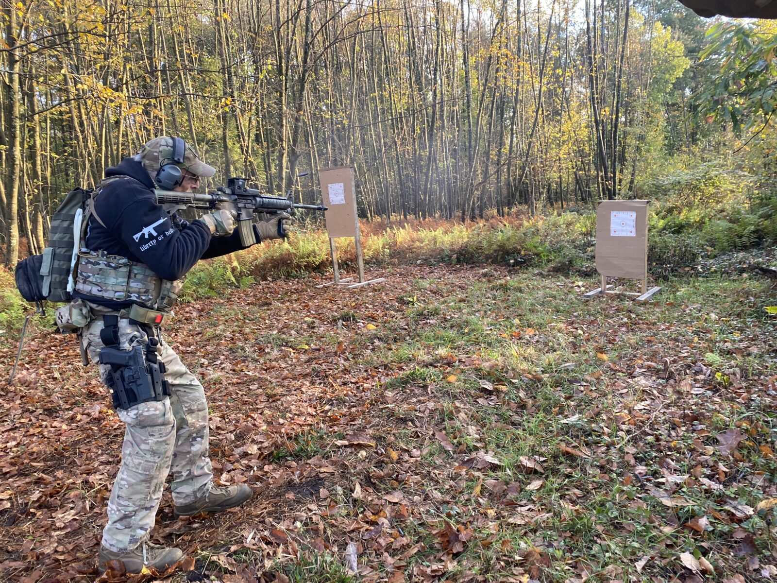 Pennsylvania Volunteer Militia member Bob Gardner shoots an AR-15 rifle during a militia training weekend at a remote part of Pennsylvania’s Allegheny Plateau in October. Gardner has shown up to protests around the country with other militias as a kind of self-appointed security force, which some experts say can increase the potential for violence.