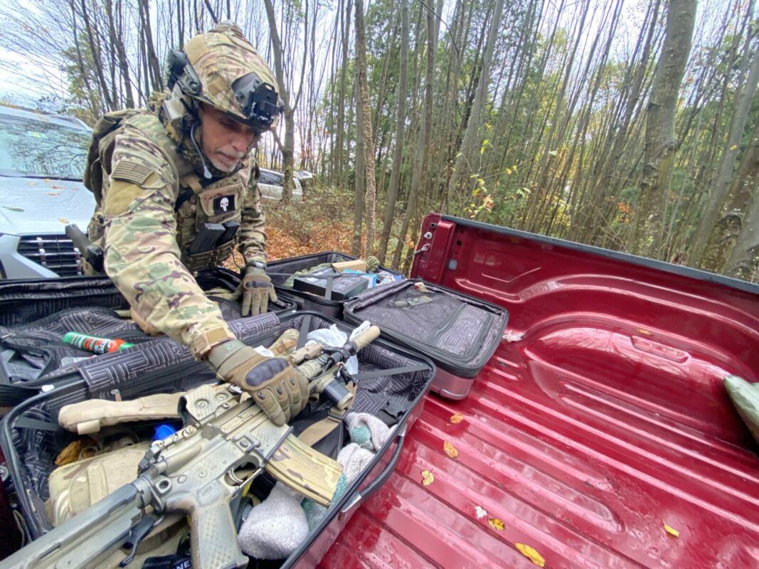 Pennsylvania Volunteer Militia leader Christian Yingling grabs his AR-15 rifle during his militia’s monthly training in a remote corner of Pennsylvania’s Allegheny Plateau. Yingling’s group is part of an ascendant militia movement that has become emboldened in the past few years, with increasingly public armed activity.