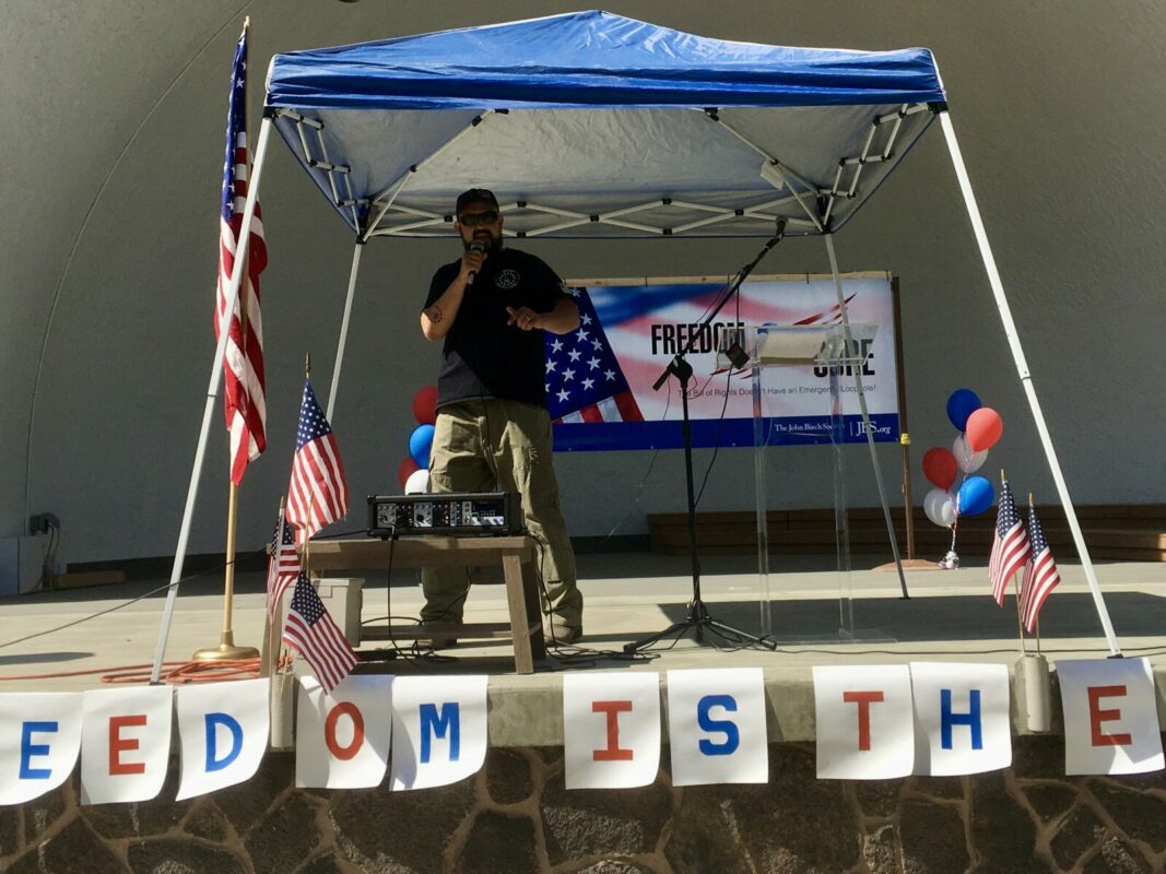 Real 3%ers Of Idaho leader Eric Parker gives a speech at a John Birch Society rally protesting pandemic measures in Twin Falls, Idaho in August 2020. Parker has become one of the country's most prominent militia leaders.