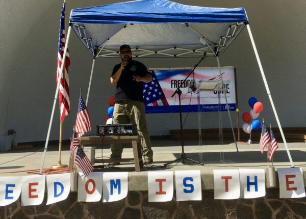 Real 3%ers Of Idaho leader Eric Parker gives a speech at a John Birch Society rally protesting pandemic measures in Twin Falls, Idaho in August 2020. Parker has become one of the country's most prominent militia leaders.
