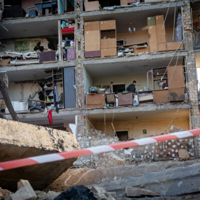 March 19: A Russian rocket attack destroyed apartments in the Vitryani Hory neighborhood of Kyiv, killing one man and injuring five, including children. Volunteers and residents work to clean up the aftermath.