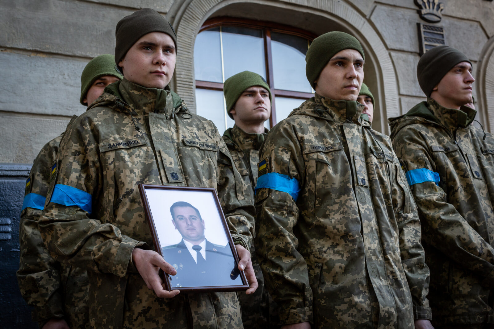 Ukrainian soldiers holding the photo of one of the 35 soldiers killed from the bombing of the International Peacekeeping and Security Center in Yavoriv outside of Lviv near the border with Poland Sunday morning. A funeral was held for three of those killed at the Church of the Most Holy Apostles Peter and Paul in Lviv, Ukraine.