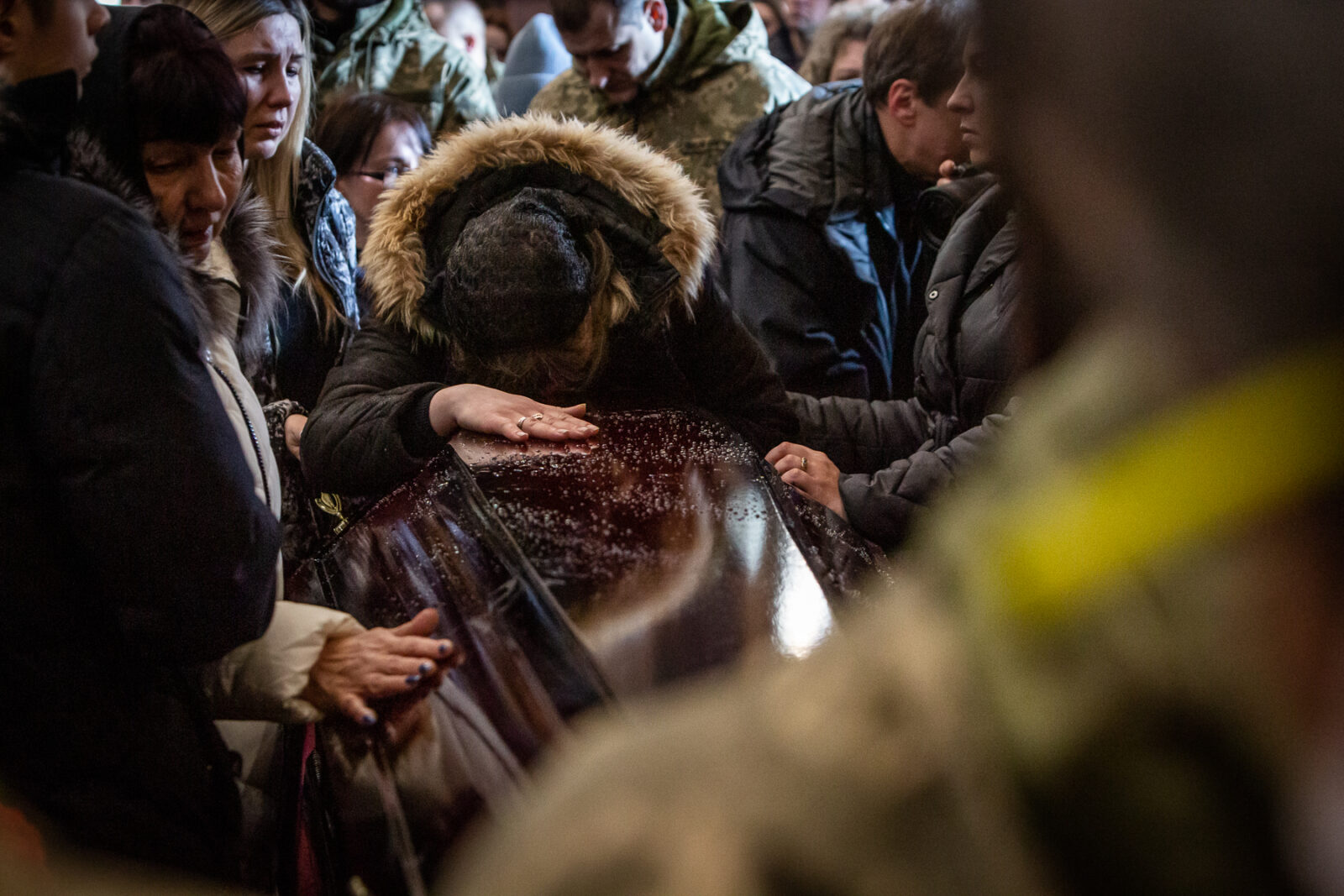 A relative of one of the 35 soldiers killed from the Sunday morning bombing of the International Peacekeeping and Security Center in Yavoriv outside of Lviv near the border with Poland. A funeral was held for three of those killed at the Church of the Most Holy Apostles Peter and Paul in Lviv, Ukraine.