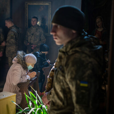 A funeral was held for three of those killed at the International Peacekeeping and Security Center in Yavoriv outside of Lviv near the border with Poland Sunday morning. It was held at the Church of the Most Holy Apostles Peter and Paul in Lviv, Ukraine. Women praying at the alter of the Virgin Mary during the funeral.