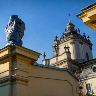 An 18th-century statue is covered at the entrance to St. George Catholic Cathedral in Lviv, Ukraine in preparation for possible Russian bombing.