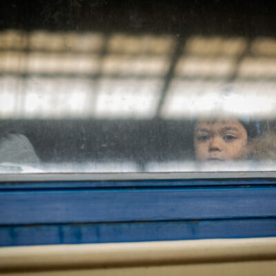 Ukrainians fleeing from the fighitng pass through Lviv Train Station on their way to neighboring European countries.