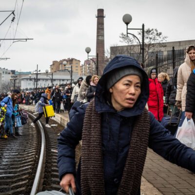 March 5: A woman approaches the Lviv train station to cross the border. The station normally runs four trains a day to Poland.