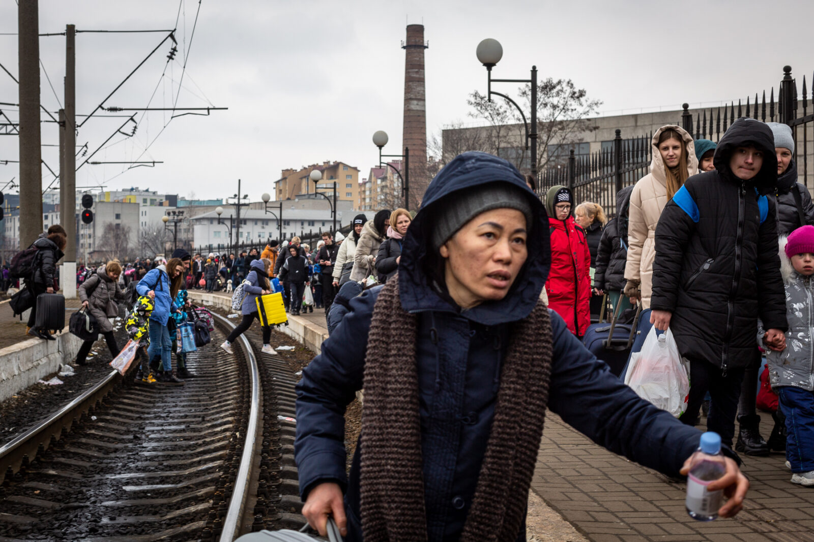 March 5: A woman approaches the Lviv train station to cross the border. The station normally runs four trains a day to Poland.