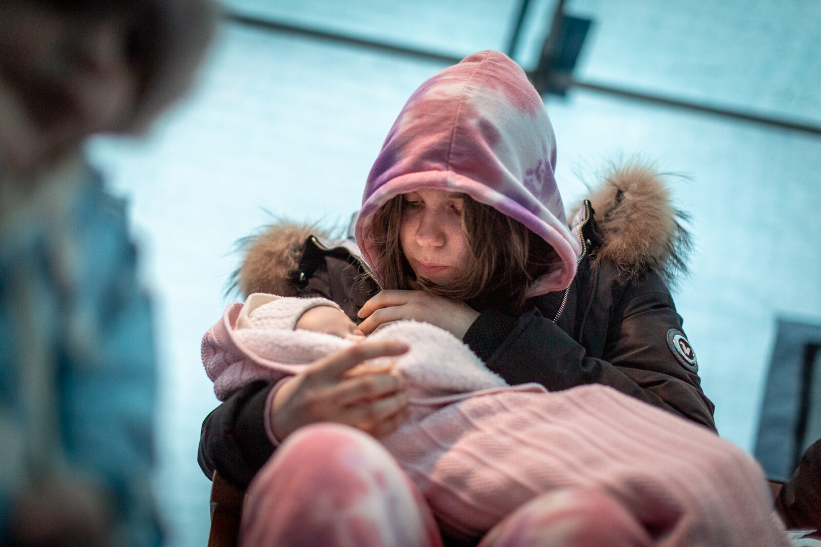 March 5: A woman cradles a baby in Lviv, amid a throng of people waiting to get out of the country.