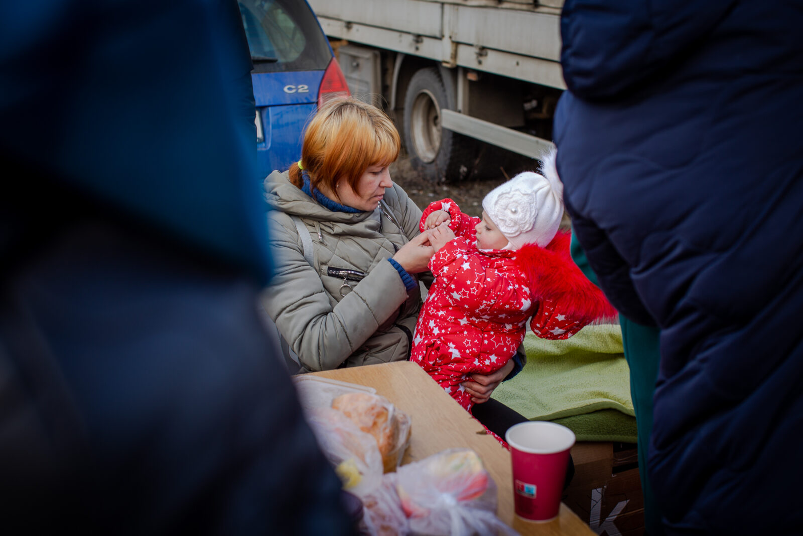 Ukrainian refugees who just crossed the border into Medyka, Poland