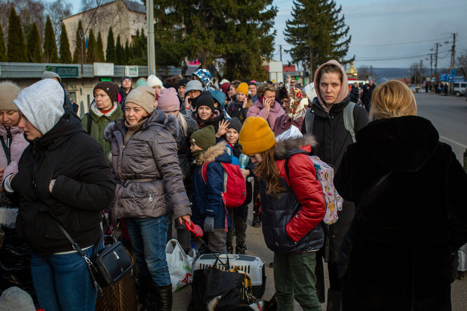 Ukrainian refugees waiting in a long line to cross into Medyka, Poland from Ukraine.