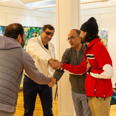Carmen Gentile, Postindustrial founder with Zubair Babakarkhail, center right, and guests at a fundraiser for Team Zubair, on Wednesday, Oct. 18, at Atithi Studios in Sharpsburg, Pennsylvania. Zubair is the namesake for the nonprofit effort, which is all volunteer and supported mostly through individual donations.