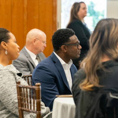 Jessica Brooks, center, and Marlin Brooks, during Advancing Ambition, a live event with panel discussions focused on cybersecurity, and the need for more job training in this area, at Piedmont Park, on Tuesday, Oct. 18.