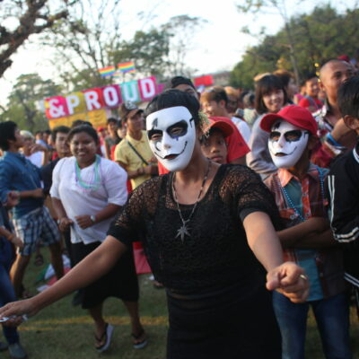 People dancing wearing face masks on May 17, 2018, during the LGBT Day event held by an organization in Yangon, Burma. (Hong Sar)