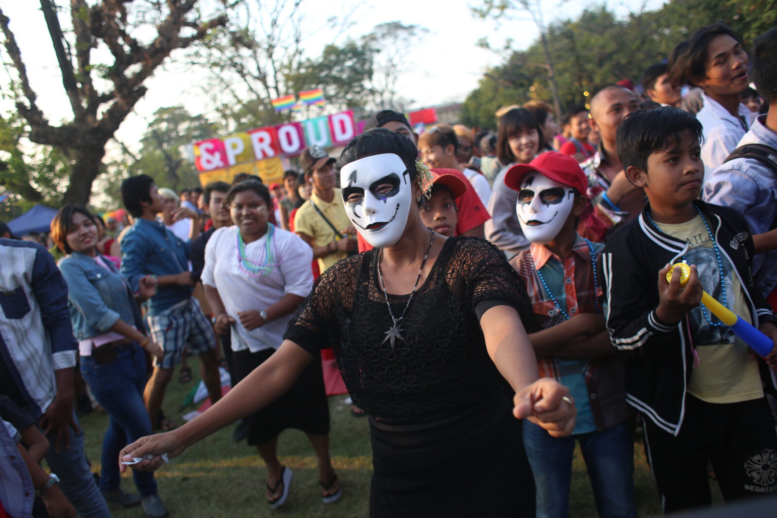 People dancing wearing face masks on May 17, 2018, during the LGBT Day event held by an organization in Yangon, Burma. (Hong Sar)