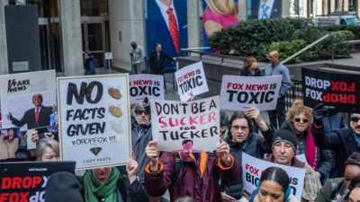 Dozens of protesters converged at Fox News' Headquarters, on March 13, 2019, as the corporation held an "emergency" meeting in order to court nervous brands to continue advertising on the network. The protest, titled "Drop Fox" was organized following a slew of negative stories about Fox News, including old audio tapes of Fox host Tucker Carlson making, racist, misogynistic, and bigoted statements. (Photo by Michael Nigro)(Sipa via AP Images)