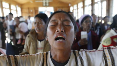 A Chin woman from Burma crying as she prays to their god at a temple on the top of a mountain in Chin state, Burma, on Dec. 22, 2014. Ethnic minorities in Burma have long suffered under military rule, and the Chin are among the most persecuted, also facing discrimination in neighboring India. (Hong Sar)