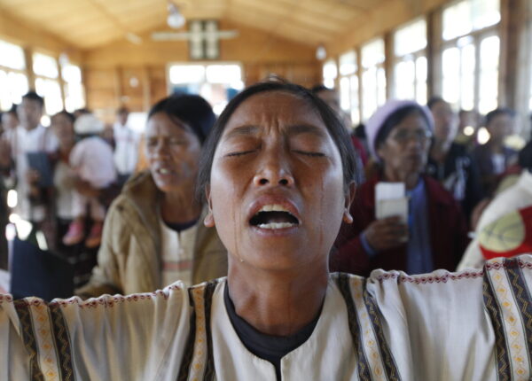 A Chin woman from Burma crying as she prays to their god at a temple on the top of a mountain in Chin state, Burma, on Dec. 22, 2014. Ethnic minorities in Burma have long suffered under military rule, and the Chin are among the most persecuted, also facing discrimination in neighboring India. (Hong Sar)