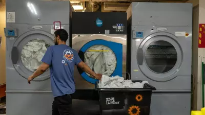 Postindustrial, Louie Colon works at Wash Cycle Laundry in Philadelphia. Photo by Jessica Kourkounis