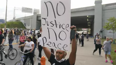Victoria Gunther marches with Black Lives Matter protesters, Friday, Sept. 25, 2020, in Louisville. Breonna Taylor's family demanded Friday that Kentucky authorities release all body camera footage, police files and the transcripts of the grand jury hearings that led to no charges against police officers who killed the Black woman during a March drug raid at her apartment. (AP Photo/Darron Cummings)