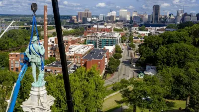 Crews work to remove the Confederate Soldiers & Sailors Monument in Libby Hill Park on July 8 in Richmond, Va. The statue is one of several that will be removed by the city as part of the Black Lives Matter reaction. Survivors of police brutality in Chicago are waiting for a memorial city officials approved five years ago. (AP Photo/Steve Helber)