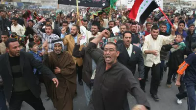 Iraqi Shiites rally for the release of Ahmed al-Shaibany, an aide to radical Shiite cleric Muqtada al-Sadr, after attending Muslim Friday prayers in Al-Sadr city, east of Baghdad, Iraq, Friday Dec. 23, 2005. Sunni Arab and secular Shiite factions demanded that an international body review complaints about voting fraud in last week's elections and threatened to boycott the new legislature. But the United Nations rejected the idea. (AP Photo/Karim Kadim)