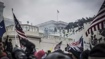 MPD and Capitol police pull back Trump supporters near the U.S. Capitol on January 06, 2021 in Washington, DC. The protesters stormed the historic building, breaking windows and clashing with police. Trump supporters had gathered in the nation's capital to protest the ratification of President-elect Joe Biden's Electoral College victory over President Trump in the 2020 election. (Photo by Shay Horse/NurPhoto via AP)