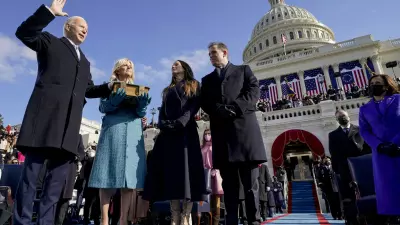 Joe Biden is sworn in as the 46th president of the United States by Chief Justice John Roberts as Jill Biden holds the Bible during the 59th Presidential Inauguration at the U.S. Capitol in Washington, Wednesday, Jan. 20, 2021, as their children Ashley and Hunter watch.(AP Photo/Andrew Harnik, Pool)