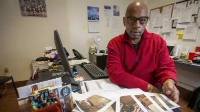 Fred Way is executive director of the Pennsylvania Alliance of Recovery Residences, which voluntarily certifies recovery houses. Here, he shows photographs of residences in the process of being inspected. (ALEJANDRO A. ALVAREZ / Philadelphia Inquirer)