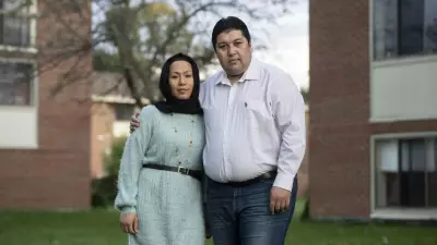 Mustafa and Noorya Aahangaran stand for a portrait in Getzville, N.Y., September 30, 2021. Libby March for Postindustrial Magazine