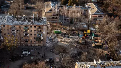 March 19: A Russian rocket attack destroyed apartments in the Vitryani Hory neighborhood of Kyiv, killing one man and injuring five, including children. Volunteers and residents work to clean up the aftermath.